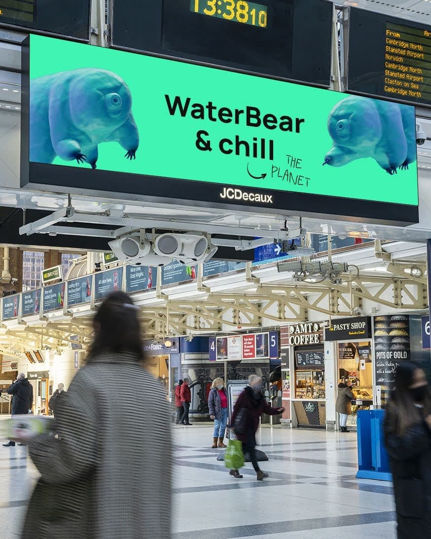 WaterBear billboard in train station